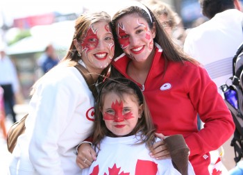 Celebrants show their Canadian pride on Canada Day near Parliament Hill in Ottawa. A recent study found that Canada has the best reputation in the world. (The Epoch Times)