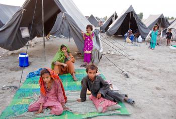 Pakistan flood victims sit at a basic tent camp August 19, 2010 in Sukkur, Pakistan. The country's agricultural heartland has been devastated, with rice, corn and wheat crops destroyed by floods. Officials say as many as 20 million people have been effected during Pakistan's worst flooding in 80 years. The army and aid organizations are struggling to cope with the scope of the wide spread scale of the disaster that has killed over 1,600 people and displaced millions. The UN has described the disaster as unprecedented, with over a third of the country under water. (Paula Bronstein/Getty Images ) Pakistan flood victims sit at a basic tent camp August 19, 2010 in Sukkur, Pakistan. The country's agricultural heartland has been devastated, with rice, corn and wheat crops destroyed by floods. Officials say as many as 20 million people have been effected during Pakistan's worst flooding in 80 years. The army and aid organizations are struggling to cope with the scope of the wide spread scale of the disaster that has killed over 1,600 people and displaced millions. The UN has described the disaster as unprecedented, with over a third of the country under water. (Paula Bronstein/Getty Images )