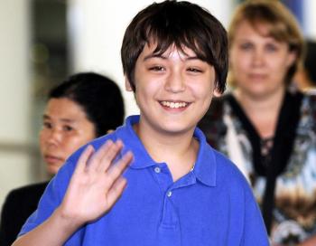 Jonathan Lee (C), a 13-year-old Korean-American, waves to journalists after returning from a week in North Korea at Beijing airport on Aug. 19. (Peter Parks/Getty Images) Jonathan Lee (C), a 13-year-old Korean-American, waves to journalists after returning from a week in North Korea at Beijing airport on Aug. 19. (Peter Parks/Getty Images)