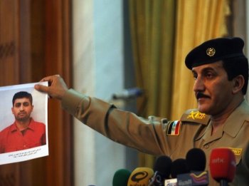 WEAKENED AL-QAEDA: The head of the Baghdad security operations announces the arrest of Abbas Najem Abdullah al-Jawari, al-Qaeda's Baghdad military chief, on charges of planning attacks against hotels and embassies that left dozens dead. (Ali Al-Saadi/Getty Images)