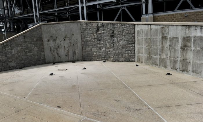 Penn State has removed the statue of Joe Paterno and now will continue on with severe limitations put on their football program. (Patrick Smith/Getty Images)
