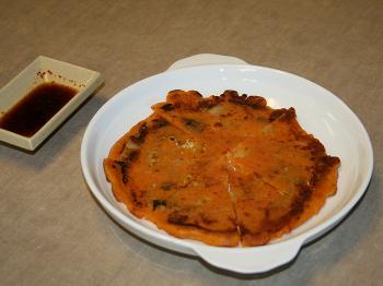 KIMCHEE PANCAKE: Slightly tangy and spicy, made with fermented kimchee People seem to just love this dish. (Jack Phillip/The Epoch Times)