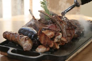 The highly acclaimed Parrilladas sizzle with flavors. (Courtesy of Esther Montero) The highly acclaimed Parrilladas sizzle with flavors. (Courtesy of Esther Montero)