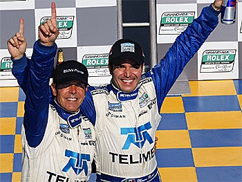 Scott Pruett (L) and Memo Rojas (R) celebrate in victory lane after winning the Grand Am Rolex Montreal 200 and the championship at Circuit Gilles-Villeneuve in Montreal, Quebec. (Geoff Burke/Getty Images)