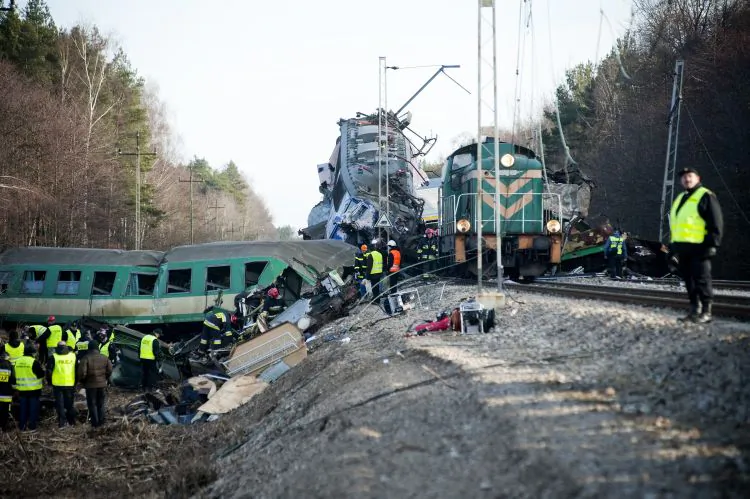 Rescuers search for victims a day after the collision of two trains on March 4, near the town of Szczekociny. A rail traffic controller in Poland will face charges overthe crash that killed 16 people. (Bartosz Siedlik/AFP/Getty Images)