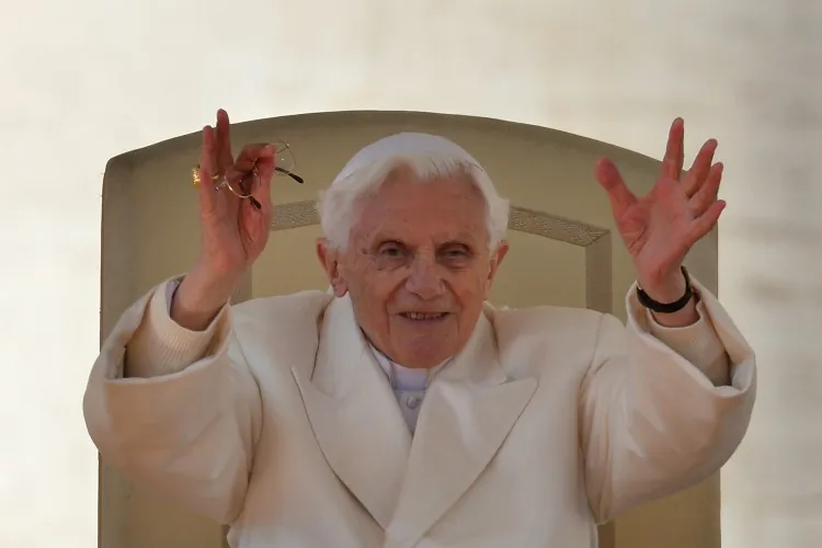 Pope Benedict XVI waves from the altar during his last weekly audience on Feb. 27, 2013 on St Peter's square at the Vatican. Pope Benedict XVI will hold the last audience of his pontificate in St Peter's Square on Wednesday on the eve of his historic resignation as leader of the world's 1.2 billion Catholics. (Gabriel Bouys/AFP/Getty Images)