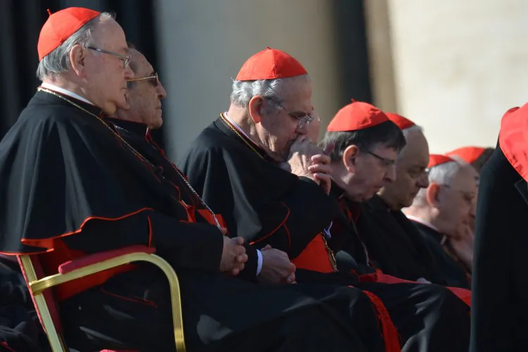 Pope Benedict XVI (R) leaves the altar with secretary Georg Gaenswein at the end of his last weekly audience on Feb. 27, 2013, at St Peter's Square at the Vatican. (Alberto Pizzoli/AFP/Getty Images)