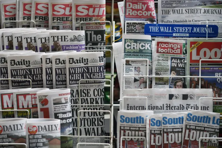 Newspapers are displayed on a stand outside a newsagent on Nov. 28, 2012 in London, England. British politicians reached a deal on contentious press regulations early March 18, 2013. (Dan Kitwood/Getty Images)