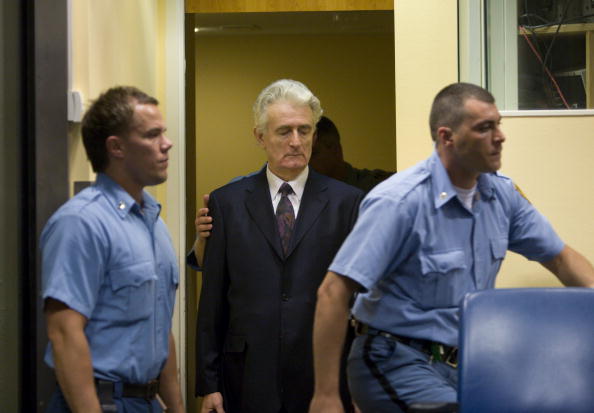 Former Bosnian Serb leader Radovan Karadzic (C) makes an initial appearance at the International Criminal Tribunal for the former Yugoslavia (ICTY) on July 31, 2008 in The Hague, The Netherlands. (Serge Ligtenberg/Getty Images)