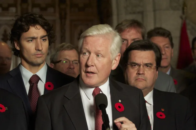 Interim Liberal Leader, seen here with his caucus in November 2011, told attendees at the Liberal Biennial Convention in Ottawa Friday that the party needn't transform itself, but rather return to its roots, in order to make a comeback. (Matthew Little/The Epoch Times)
