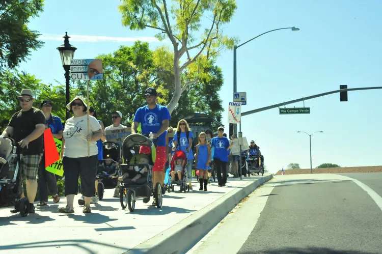 Midwives, doulas, and parents held a rally outside Saddleback Memorial Medical Center to raise awareness for birthing alternatives. The march targeted the growing number of C-sections. (Robin Kemker/Epoch Times)