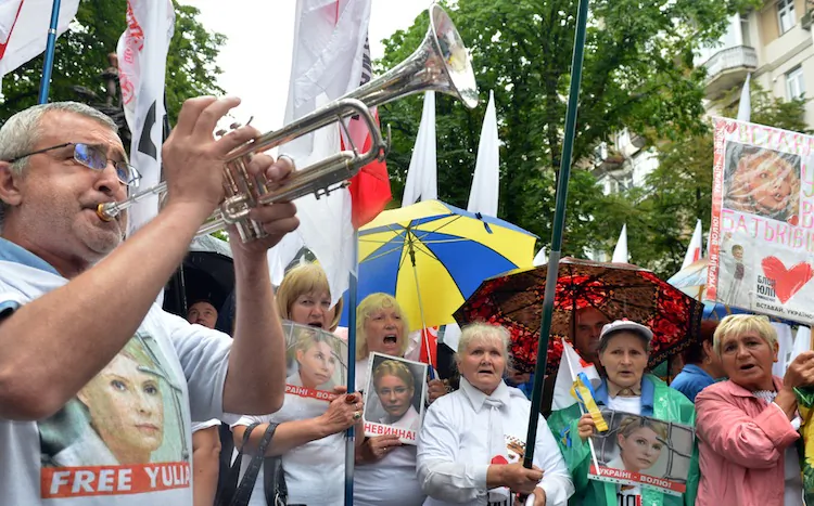 Supporters of jailed former prime minister Yulia Tymoshenko shout slogans during a rally in front of Ukraine's high court on June 26. Ukraine's high court postponed on June 26. (Sergei Supinsky/AFP/GettyImages)