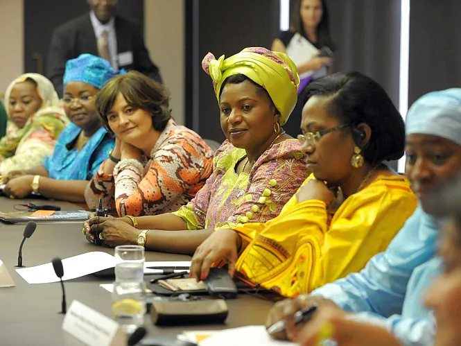 Rwanda first lady Jeannette Kagame (in red) shares a laugh with former U.S. first lady Laura Bush during the RAND African First Ladies Initiative roundtable summit at the Ford Foundation headquarters in New York City Sept. 26. (RAND)