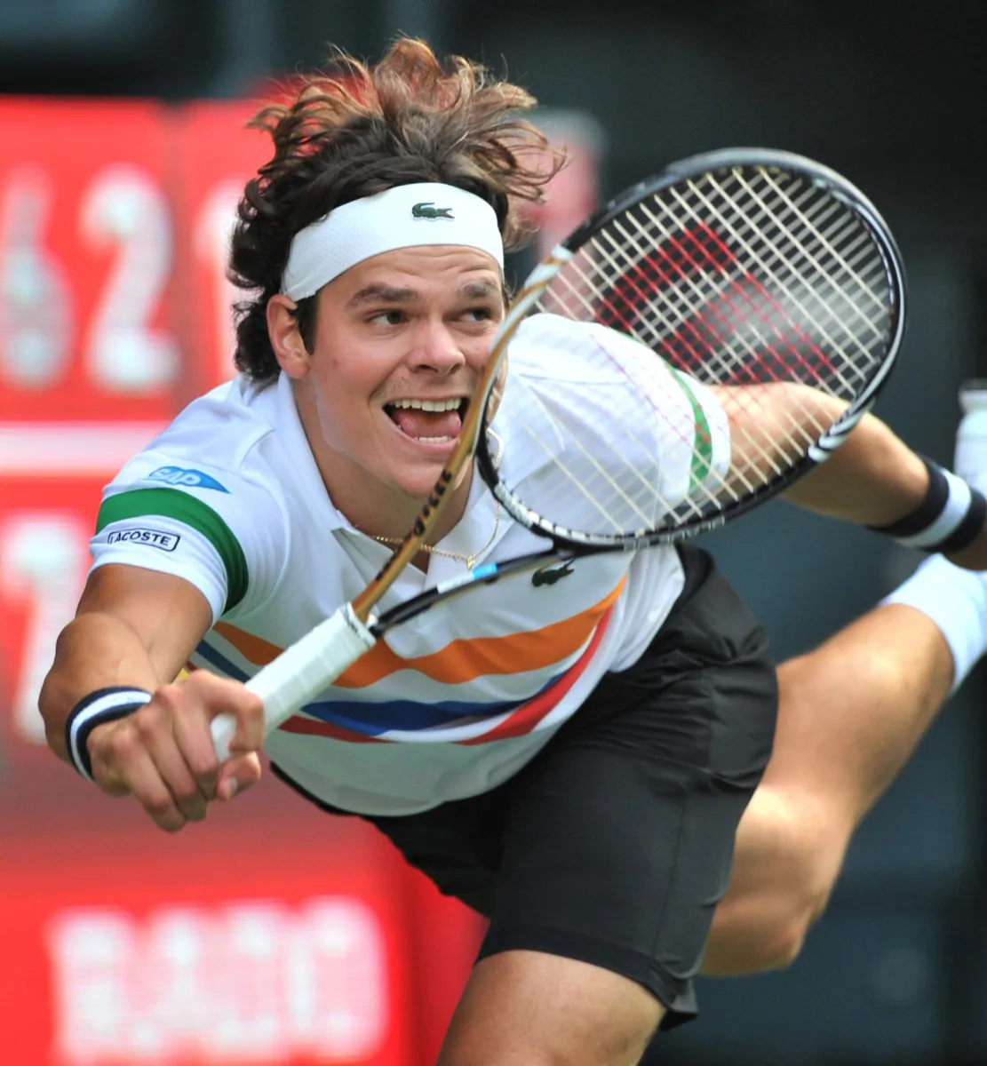 Canada’s Milos Raonic returns a shot in the Japan Open tennis final on Sunday. He reached a career-high ranking of No. 14 in the world by reaching the final. (Kazuhiro Nogi/AFP/GettyImages)