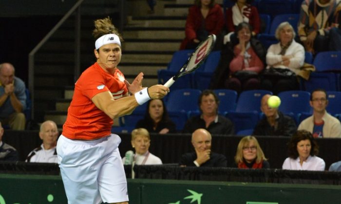 Milos Raonic of Canada fires a forehand against Spain’s Guillermo Garcia-Lopez on Sunday at the Thunderbird Sports Centre in Vancouver. Canada advanced past Spain in Davis Cup to reach the quarterfinals. (Don MacKinnon/AFP/Getty Images)