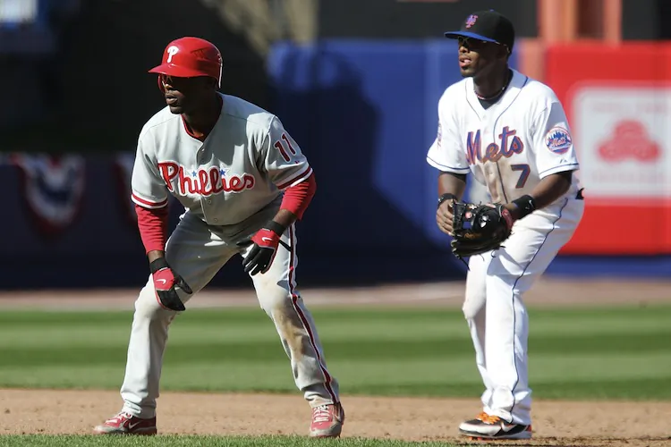 With Reyes (right) now gone, odds are that New York won't go after Rollins (left), unless his price comes down. (Jim McIsaac/Getty Images)