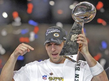 Green Bay quarterback Aaron Rodgers points toward the NFL's most coveted trophy as he celebrates the Super Bowl win over Pittsburgh last February. One of the premier signal-callers in the league, Rodgers seems poised to lead his team back to the top in 2011. (Timothy A. Clary/Getty Images)