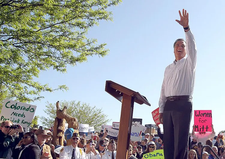 Republican presidential candidate former Massachusetts Gov. Mitt Romney waves during a campaign rally at Alice Pleasant Park in Craig, Colo., on Tuesday. Romney received enough delegates in the Texas primary May 29 to secure the GOP nomination. (Justin Sullivan/Getty Images)