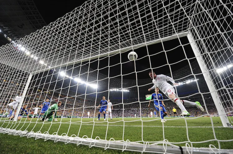 England’s Wayne Rooney heads home the game’s only goal against Ukraine on Tuesday night. (Carl de Souza/AFP/GettyImages)