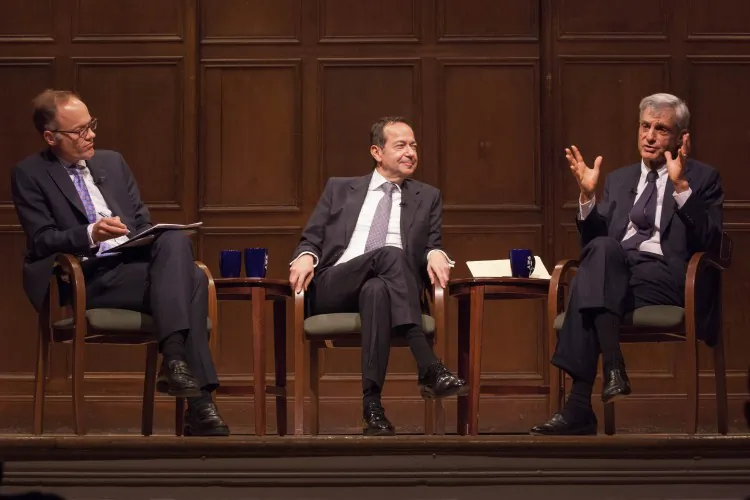 Former Treasury Secretary Robert Rubin (R) and hedge fund manager John Paulson (C) discuss the economy at an event hosted by 92Y in New York and moderated by Sebastian Mallaby (left), Jan. 22. (Valentin Schmid/The Epoch Times)