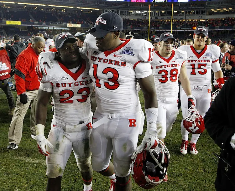 Rutgers' players Jawan Jamison (23) and Ka'Lial Glaud (13) will have a new coach next season. (Jeff Zelevansky/Getty Images)