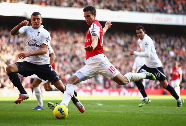 Arsenal’s Theo Walcott scored two goals to put the game out of Tottenham’s reach. (Clive Mason/Getty Images)