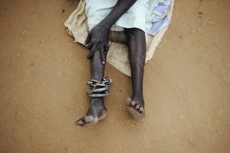 A female inmate sits in the prison yard at Juba's central prison in South Sudan on Oct. 23, 2012. In the capital of the world's newest nation, nearly 200 people await execution in filthy and crowded conditions, with many never having even seen a lawyer. (-/AFP/Getty Images)