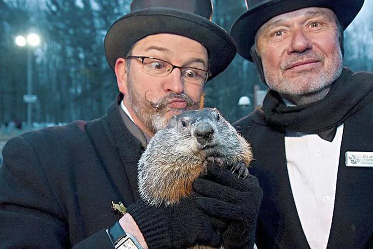 Ben Hughes (L), one of Phil’s handlers, and storm chaser Ed Jekielek (R) bask in the prognosticating rodent’s glory on Groundhog Day 2010. (Jan Jekielek/The Epoch Times)