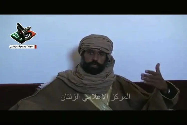 A screen shot of a video released by the Zintan Media Centre on Nov. 20, 2011 shows Saif al-Islam Gadhafi following his arrest. The one-time heir apparent of Moammar Gadhafi, is still held in ZIntan but has been indicted by the International Criminial Court. (/AFP/Getty Images)