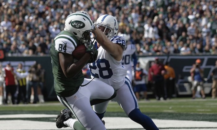 Stephen Hill (L) finds the end zone against the Colts as the Jets convert all five red-zone appearances into touchdowns Sunday. (Nick Laham/Getty Images)