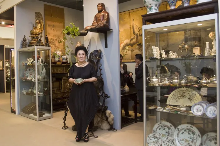 Exhibitor and fair organiser Brian Haughton sold five porcelain objects in the first few hours of the fair opening. (Simon Gross/The Epoch Times)