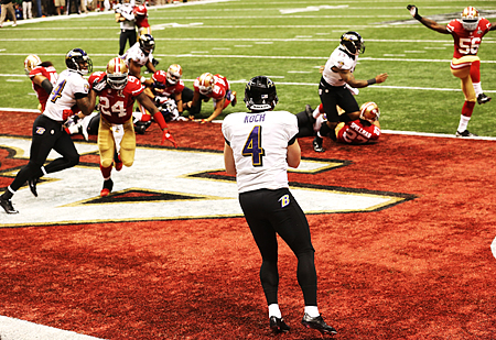 Punter Sam Koch #4 of the Baltimore Ravens holds the ball in the end zone as he takes a safety in the final seconds of the fourth quarter of Super Bowl XLVII. (Ronald Martinez/Getty Images)