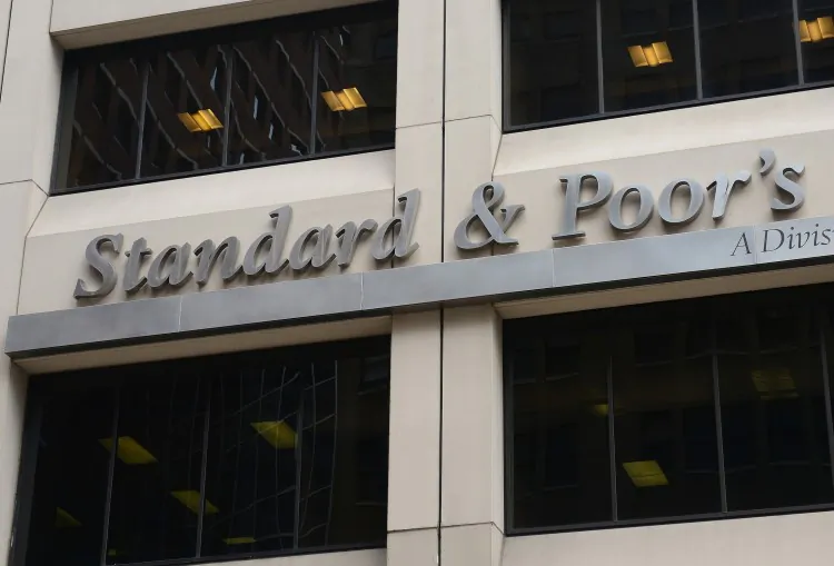 A sign for Standard & Poor's rating agency stands in front of the company headquarters in New York, on Sept. 18. (Emmanuel Dunand/AFP/GettyImages)