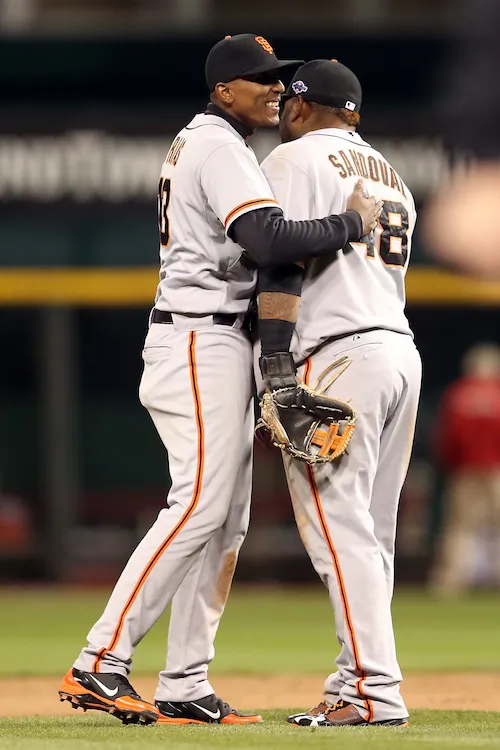 Pablo Sandoval (R) homered and drove in three runs for the Giants. (Andy Lyons/Getty Images)