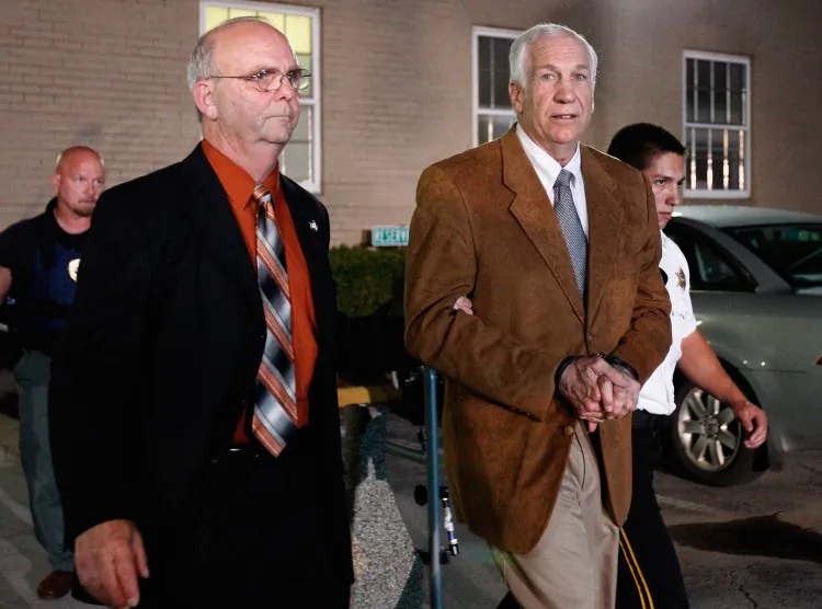 Former Penn State assistant football coach Jerry Sandusky leaves the Centre County Courthouse in handcuffs after a jury found him guilty in his sex abuse trial on June 22, 2012, in Bellefonte, Penn. The jury found Sandusky guilty on 45 of 48 counts in the sexual abuse trial of the former Penn State assistant football coach, who was charged with sexual abuse of 10 boys over a 15-year period. (Rob Carr/Getty Images)