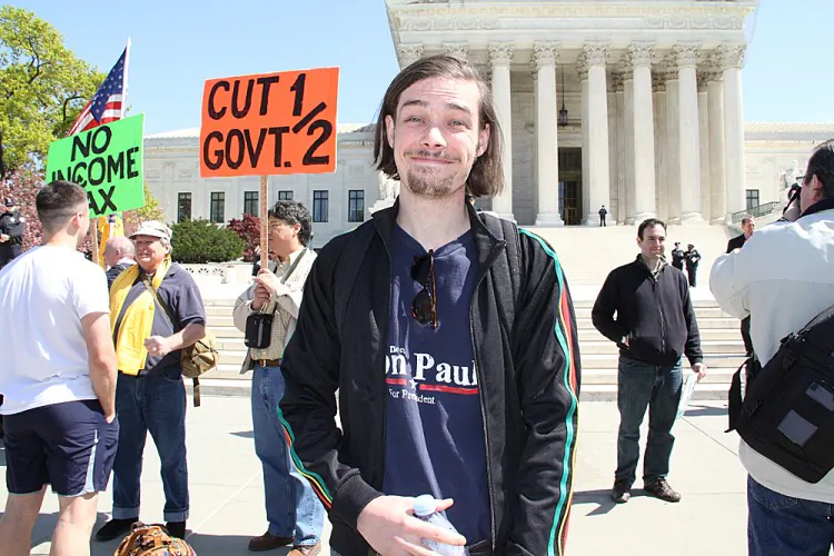 Outside the courtroom, opponents of the ACA protested at a rally on Tuesday. (Shar Adams/The Epoch Times)