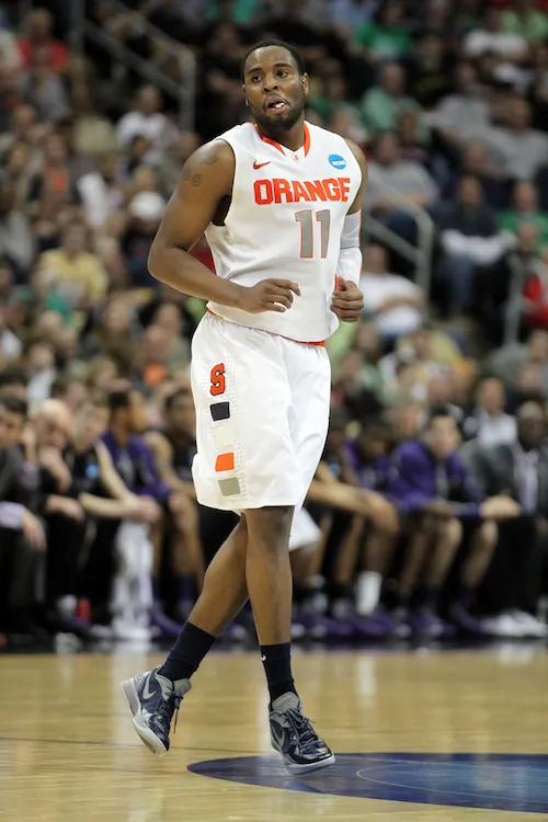 Syracuse guard Scoop Jardine has calmly helped the Orange advance to the Sweet 16, despite Fab Melo's absence. (Gregory Shamus/Getty Images)