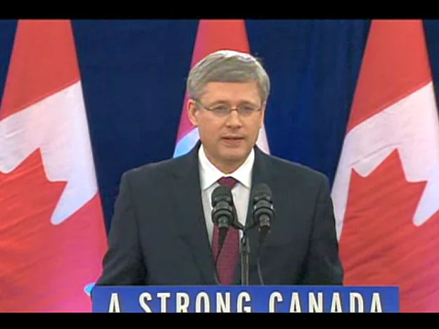 A screenshot from CBC News, taken on Dec. 7, 2012, shows Canadian Prime Minister Stephen Harper announcing that the government would allow Chinese state-owned CNOOC to take over Calgary-based Nexen Inc., while signalling Canada’s disapproval of increased takeovers by foreign state-owned enterprises in Canada's oil sands. (Screenshot/CBC News)