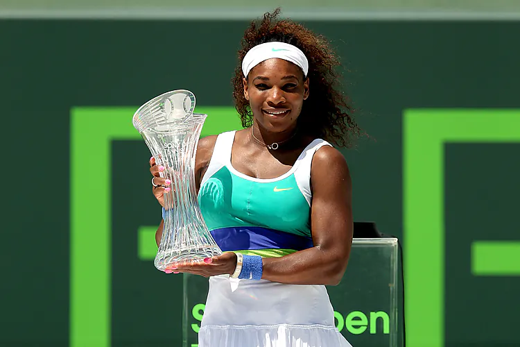 Serena Williams poses with the winner’s trophy after defeating Maria Sharapova during the women’s final of the Sony Open at Crandon Park Tennis Center in Key Biscayne, Florida on March 30. (Matthew Stockman/Getty Images)
