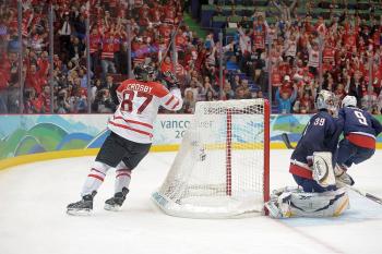 Canada's Sidney Crosby raises his arms after putting the puck past Ryan Miller in the U.S. goal. (Harry How/Getty Images) Canada's Sidney Crosby raises his arms after putting the puck past Ryan Miller in the U.S. goal. (Harry How/Getty Images)