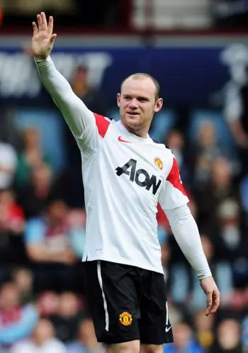HAT-TRICK WINNER: Superstar Wayne Rooney of Manchester United celebrates his hat-trick during the Barclays Premier League match between West Ham United and Manchester United at the Boleyn Ground on April 2, 2011 in London, England. (Mike Hewitt/Getty Images)