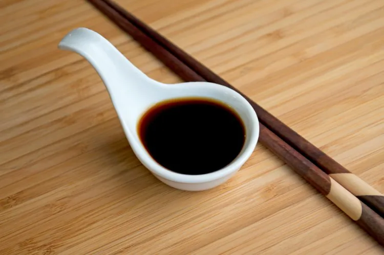 A spoon with soy sauce. (Vanessa Rios/The Epoch Times)