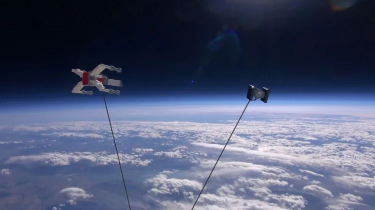 Toy models of an X-Wing and a Tie Fighter from the “Star Wars” films, built from LEGOs, are shown at the edge of space. (JP Aerospace)
