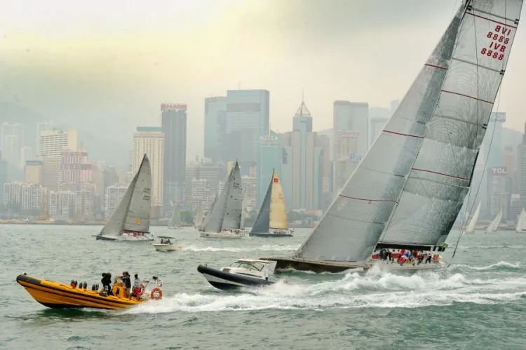 Flying start ... ‘Genuine Risk’ (foreground) took an early lead in the Rolex China Sea Race 2012. The 90-foot maxi is seen here after crossing the start line in Victoria Harbour, offshore from the Royal Hong Kong Yacht Club, on Wednesday afternoon, April 4.( Sung Bilung/The Epoch Times)