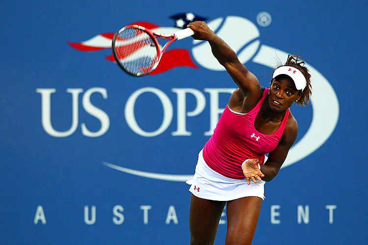 Sloane Stephens serves against Francesca Schiavone during their women's singles first round match on Day Two of the 2012 US Open. (Alex Trautwig/Getty Images)