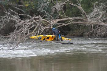 Day 10: The kayak capsizes as Steve is getting back into it after towing it through the rapids. (Courtesy kayak4earth.com) Day 10: The kayak capsizes as Steve is getting back into it after towing it through the rapids. (Courtesy kayak4earth.com)