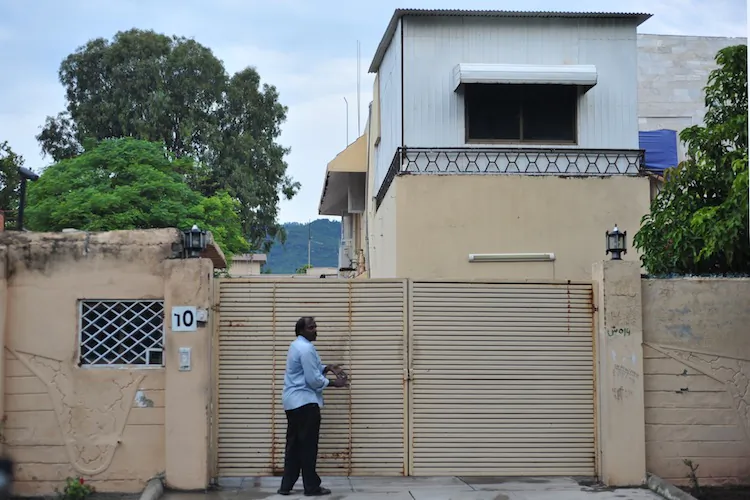A Pakistani is pictured in front of the Save the Children office in Islamabad on Sept. 6. Pakistan has ordered all of Save the Children's foreign staff to leave the country within four weeks. (Farooq Naeem/AFP/GettyImages)