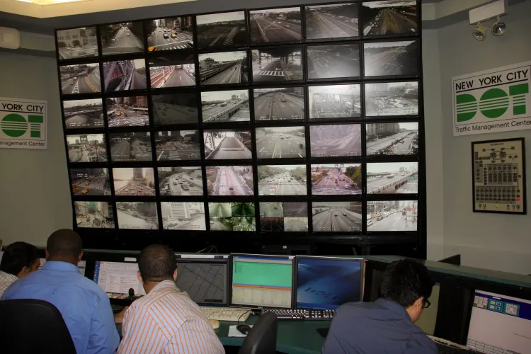 Traffic engineers monitor Midtown traffic on screens in the city's Traffic Management Center in Long Island City.(Zachary Stieber/The Epoch Times)
