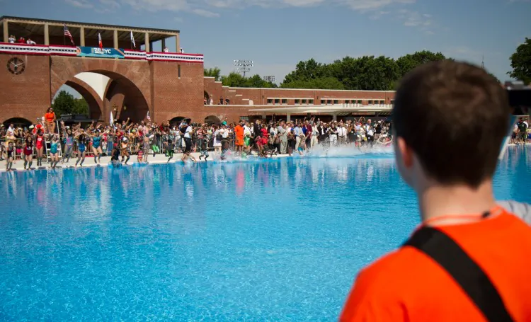 Richard Modzelewski joined in the celebration at McCarren Pool, with his daughter Sarah (R) and her friend Olivia. (Zachary Stieber/The Epoch Times)