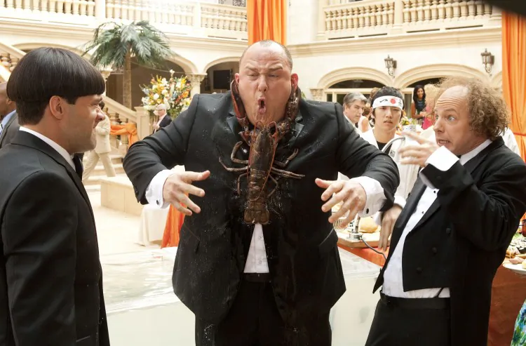 Chris Diamantopoulos (L), Will Sasso (C), and Sean Hayes in the comedy “The Three Stooges,” a film about how The Three Stooges become stars in a reality TV show after stumbling into a murder plot while trying to save their childhood orphanage. (Peter Ivoino/ Twentieth Century Fox Film Corporation)